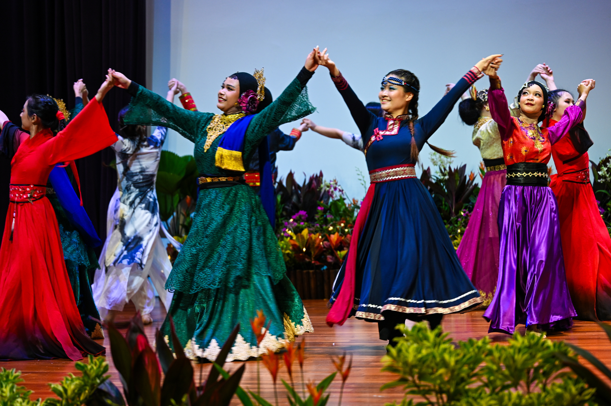 NP Chinese Dance and NP Malay Cultural Club presenting Rhythm & Roots, a vibrant cultural performance celebrating diversity through dance.